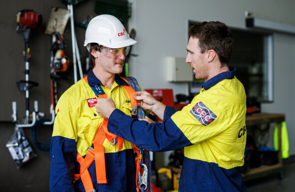 Two CBC Group Workers fitting safety gear 