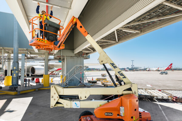 CBC Group tradesman performing aviation maintenance on a cherry picker 